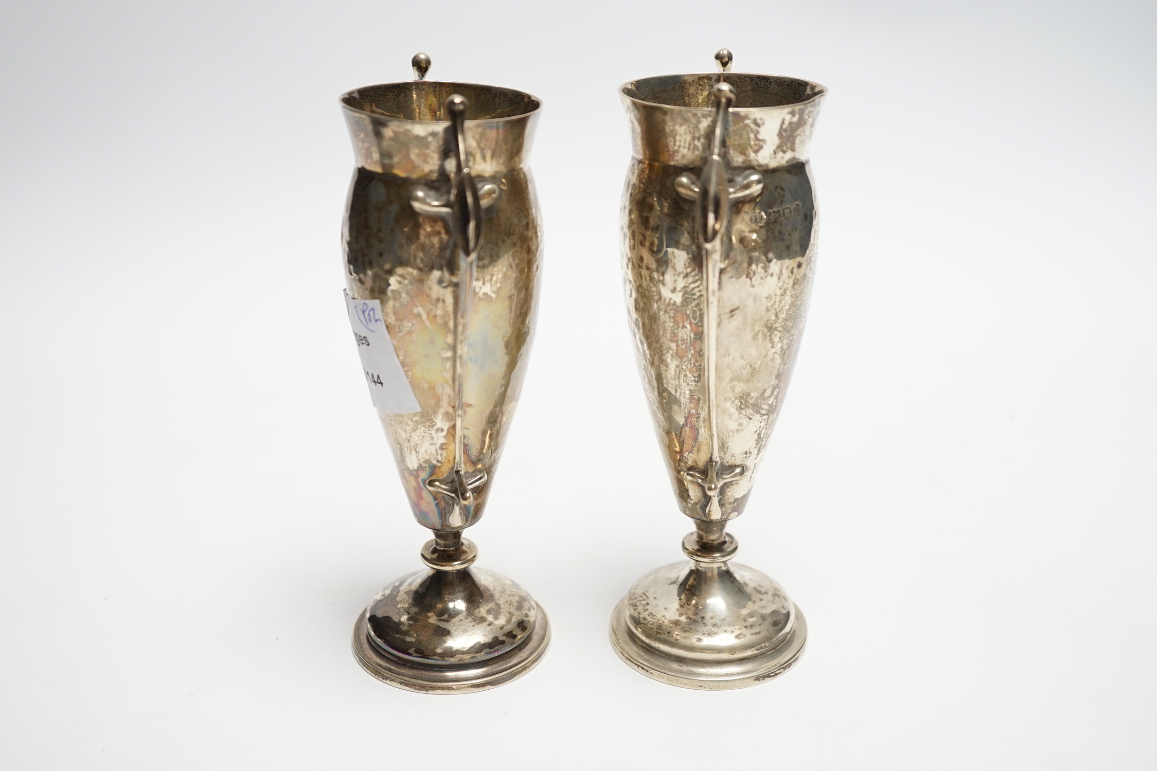 A pair of Edwardian Art Nouveau silver two handled posy vases, Charles Edwards, London, 1905, 16cm, 8oz.